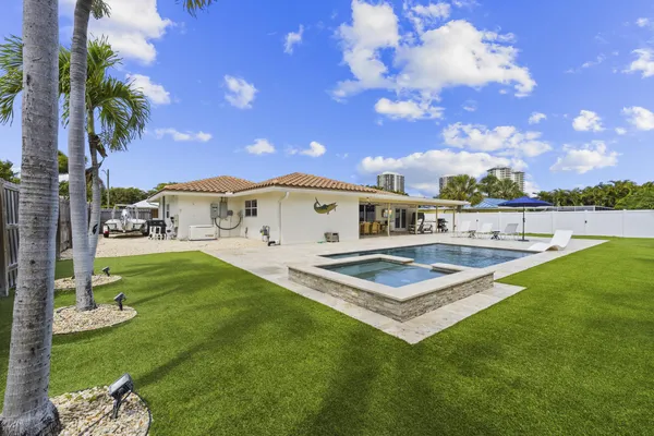 a view of a big house with a big yard