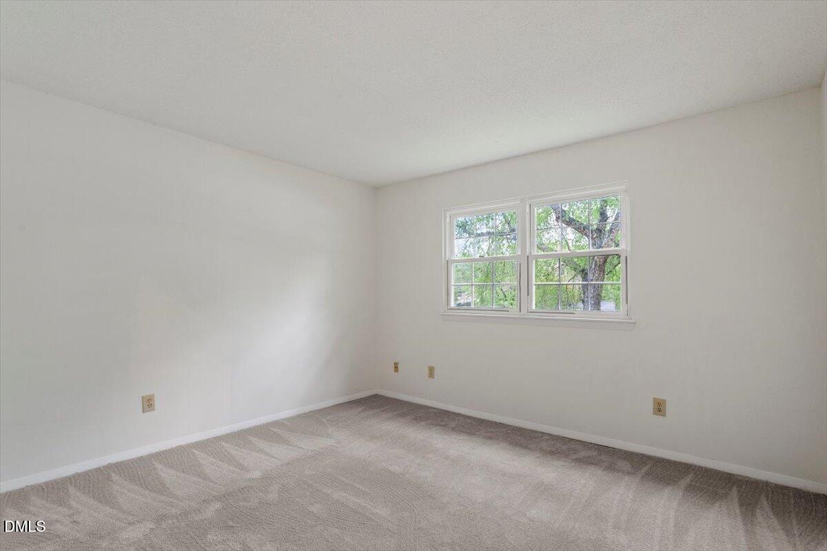 1217 H Manassas Court, Unit H Raleigh, NC 27609 - Photo 21 of 30 an empty room with a window