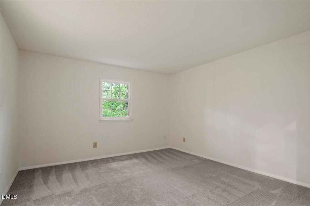 1217 H Manassas Court, Unit H Raleigh, NC 27609 - Photo 23 of 30 an empty room with a window