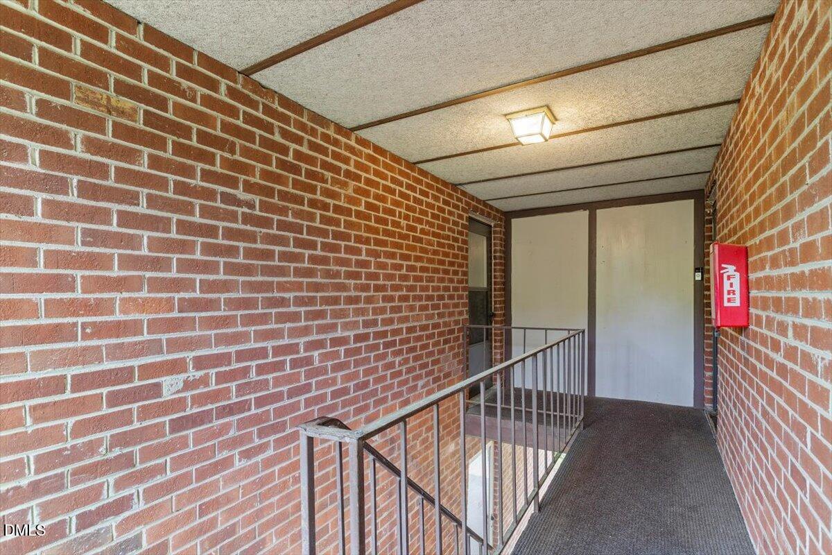1217 H Manassas Court, Unit H Raleigh, NC 27609 - Photo 4 of 30 a view of a brick wall