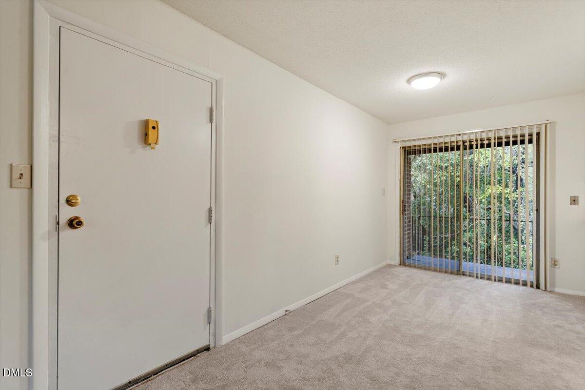 1217 H Manassas Court, Unit H Raleigh, NC 27609 - Photo 7 of 30 a view of a room with an empty space