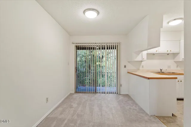 a view of a kitchen and a sink