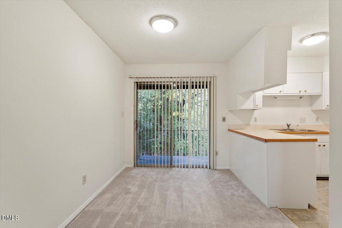 1217 H Manassas Court, Unit H Raleigh, NC 27609 - Photo 8 of 30 a view of a kitchen and a sink