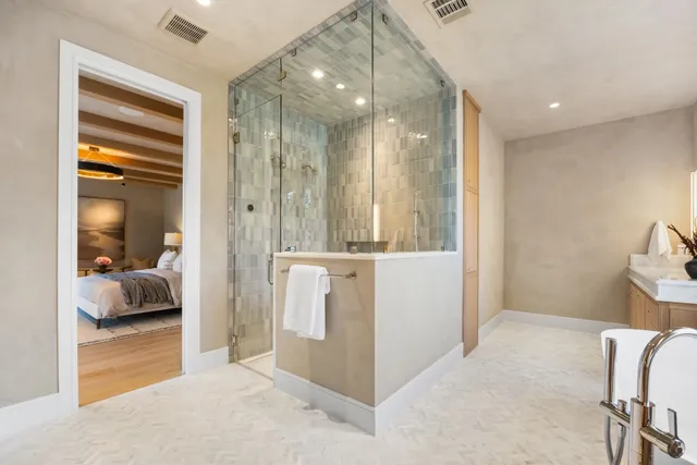 a en suite bathroom with a tub and shower