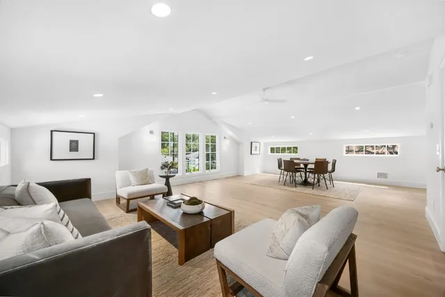 a bathroom with a double vanity sink toilet and a mirror