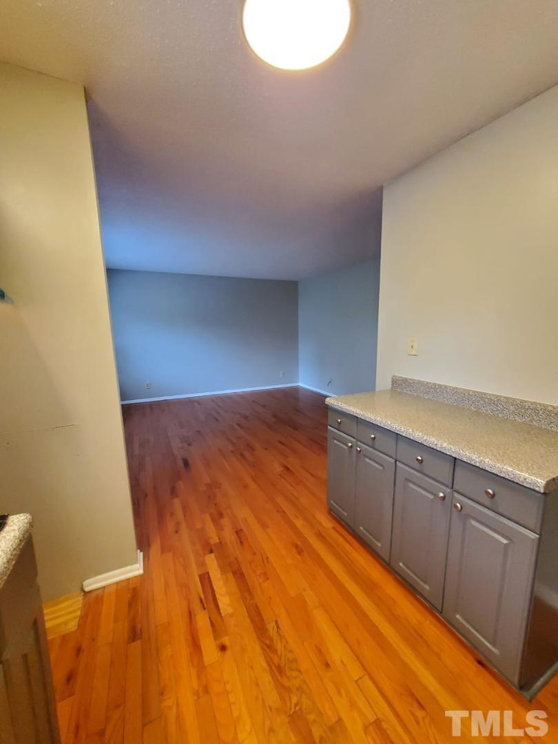 1011 Morreene Road, Unit 31 Durham, NC 27705 - Photo 4 of 5 a view of a room with wooden floor