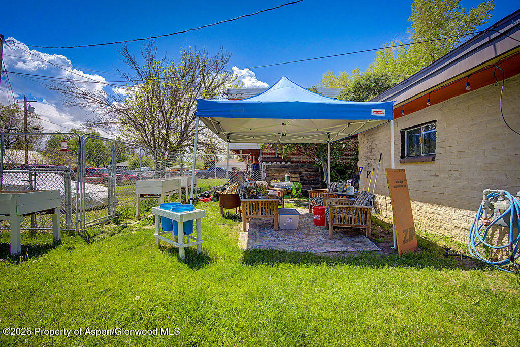 625 Russell Street Craig, CO 81625 - Photo 12 of 35 a view of a chairs and table in backyard of the house