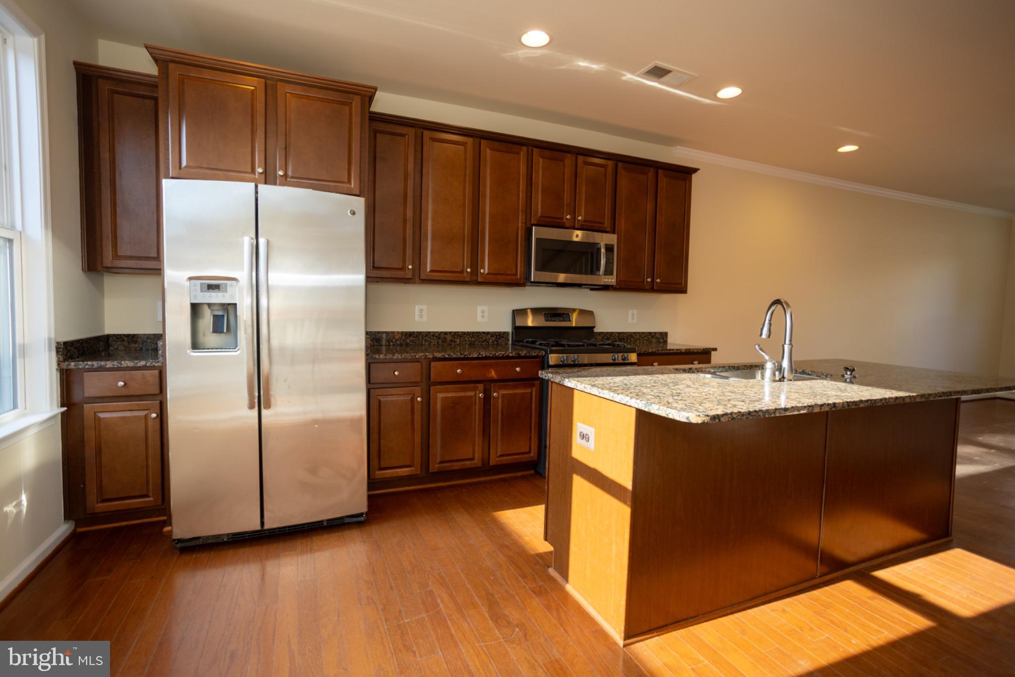 8941 Quarry Road Manassas, VA 20110 - Photo 13 of 44 Modern kitchen with sleek finishes.
