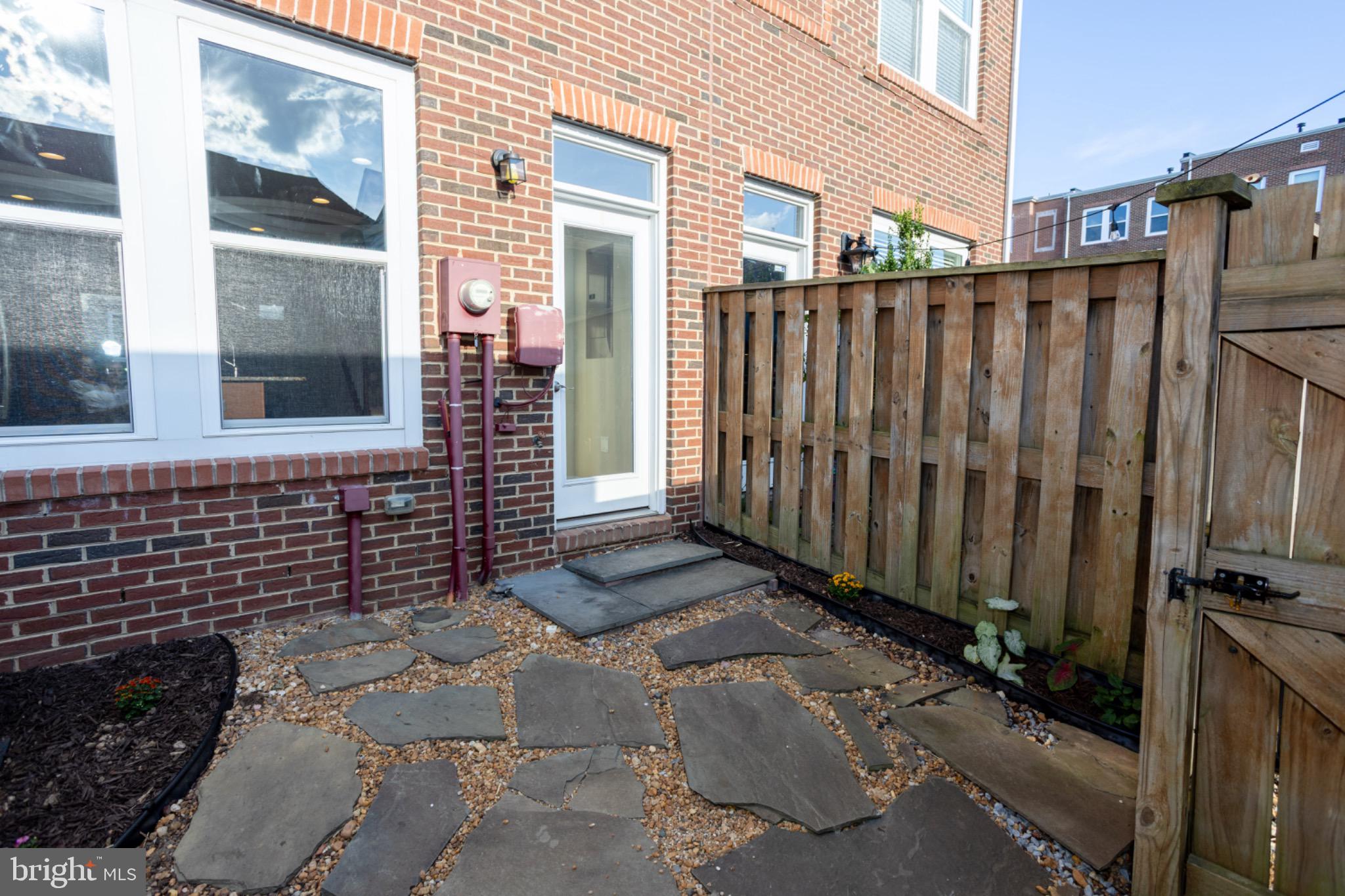 8941 Quarry Road Manassas, VA 20110 - Photo 10 of 44 Charming entryway with stone pathway.