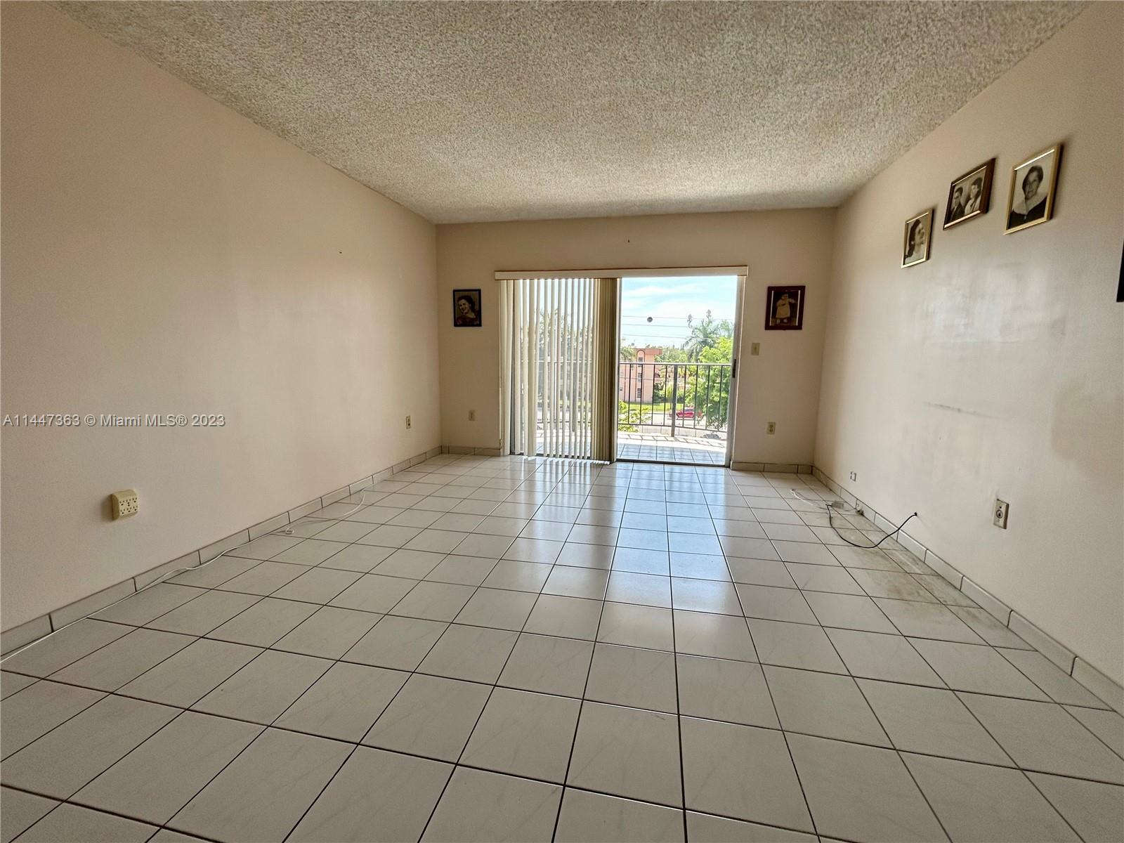 5201 Northwest 7th Street, Unit 403 Miami, FL 33126 - Photo 14 of 17 a view of an empty room and window