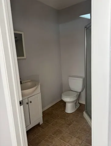 a bathroom with a toilet and a sink