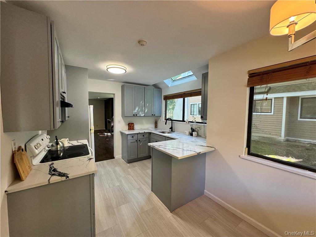 17 Rambling Brook Road Chappaqua, NY 10514 - Photo 4 of 32 Brand new gray cabinetry, new stone countertops and gorgeous new flooring