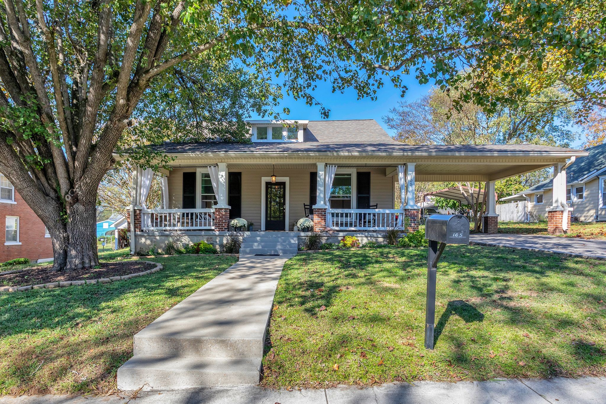 a view of a house with a backyard porch and sitting area