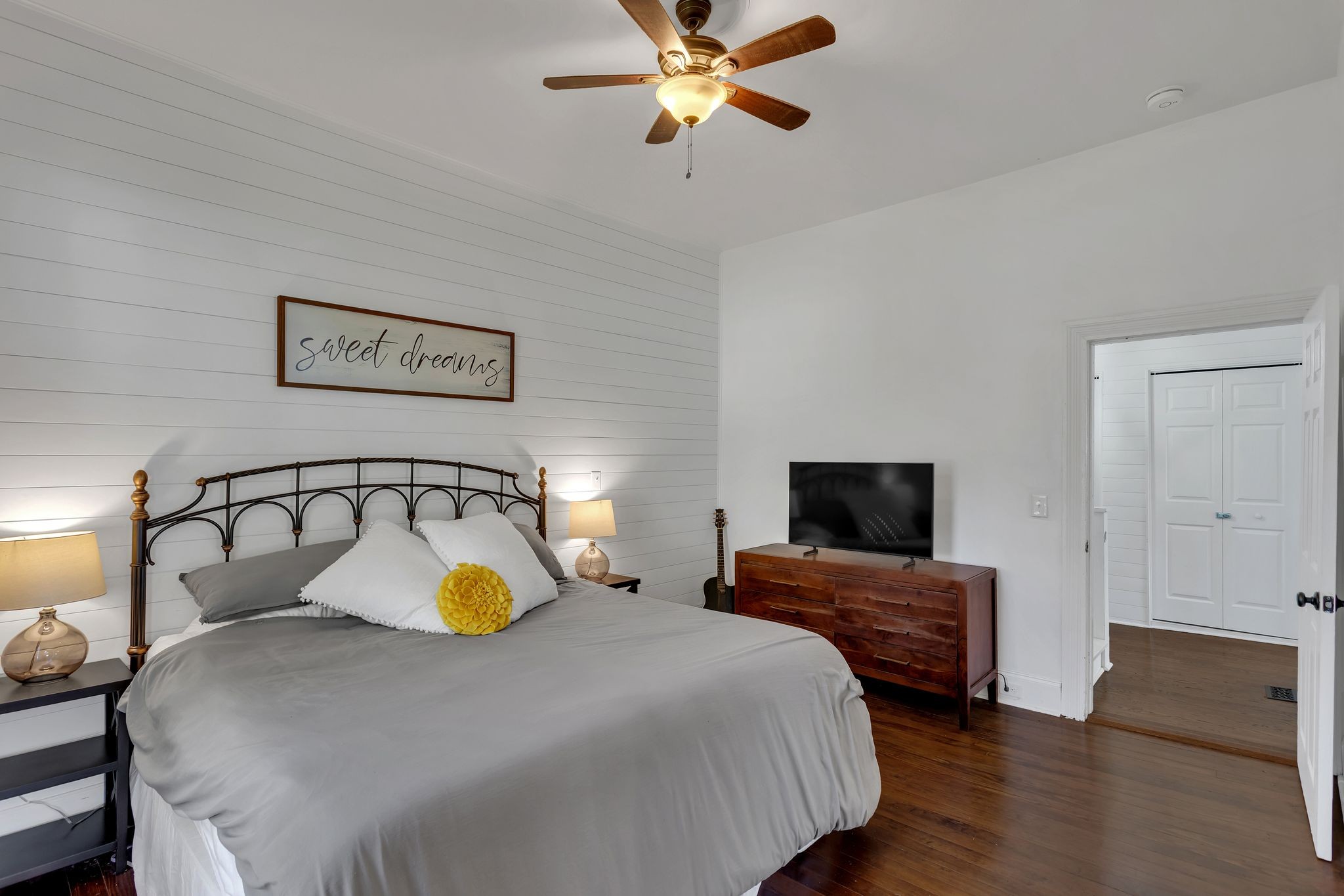 105 3rd Avenue Columbia, TN 38401 - Photo 14 of 21 a bedroom with a bed and wooden floor