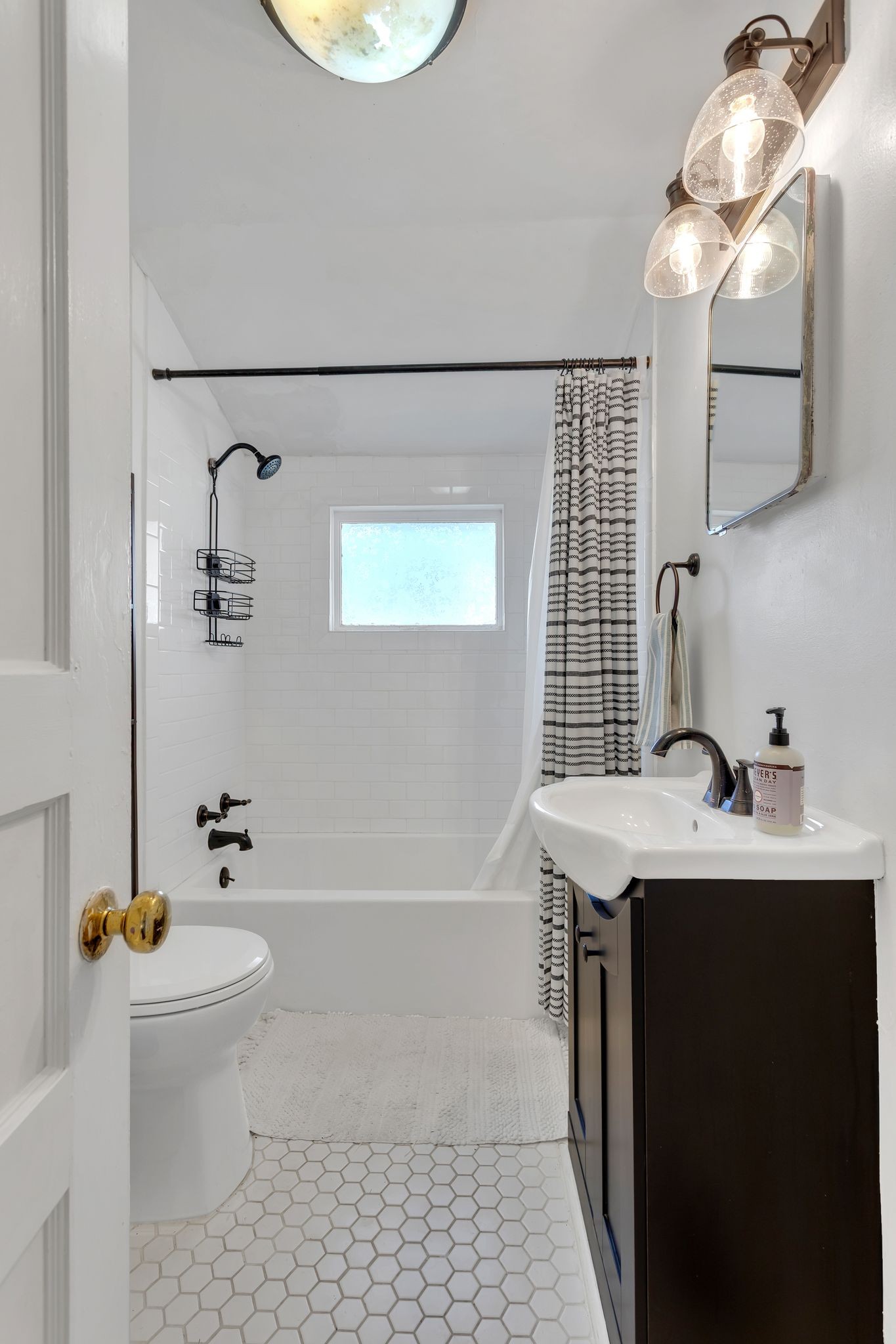 105 3rd Avenue Columbia, TN 38401 - Photo 15 of 21 a bathroom with a sink a toilet and shower