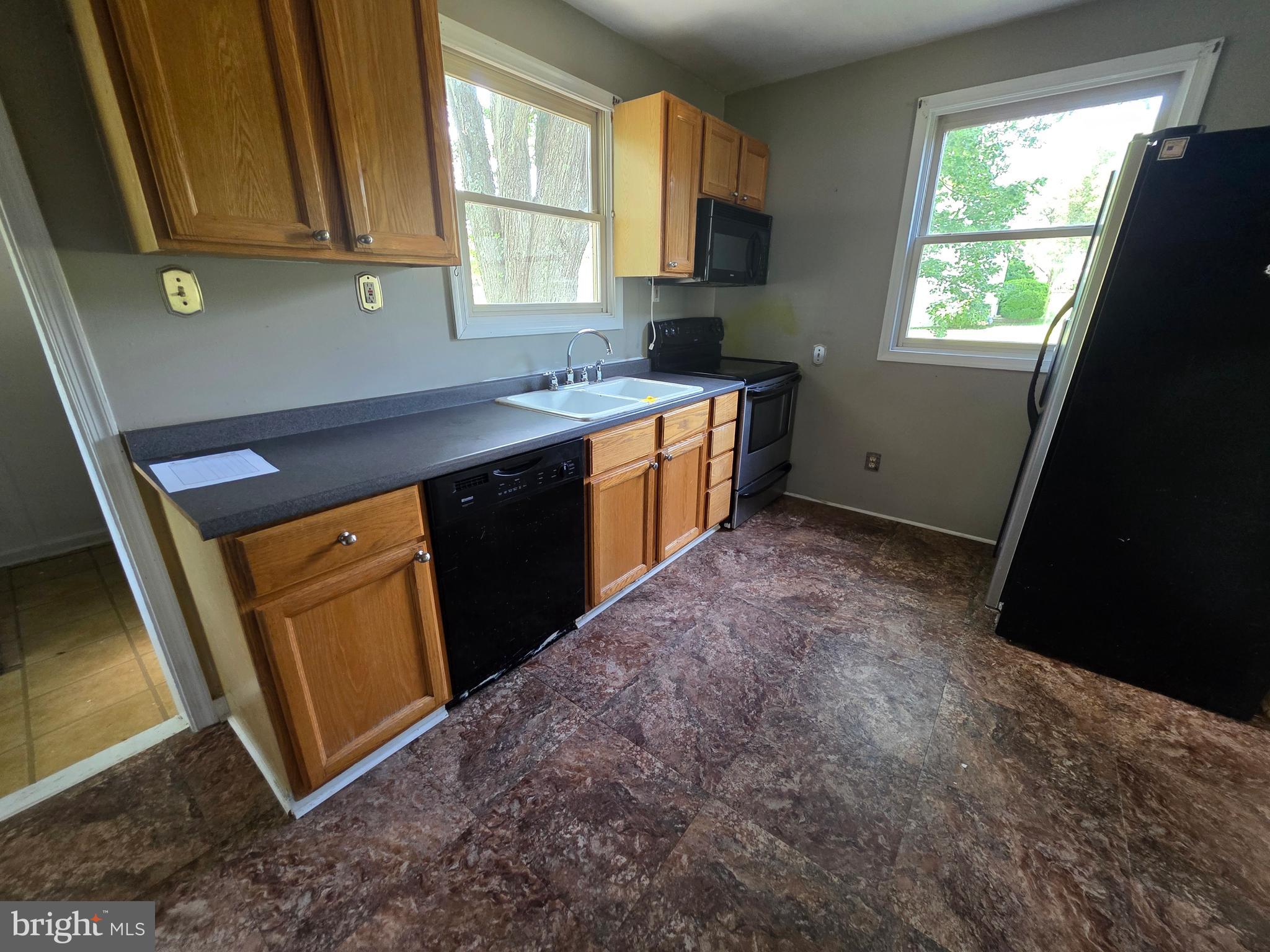2590 Hallowing Point Road Prince Frederick, MD 20678 - Photo 2 of 10 a kitchen with stainless steel appliances granite countertop a sink stove and a refrigerator
