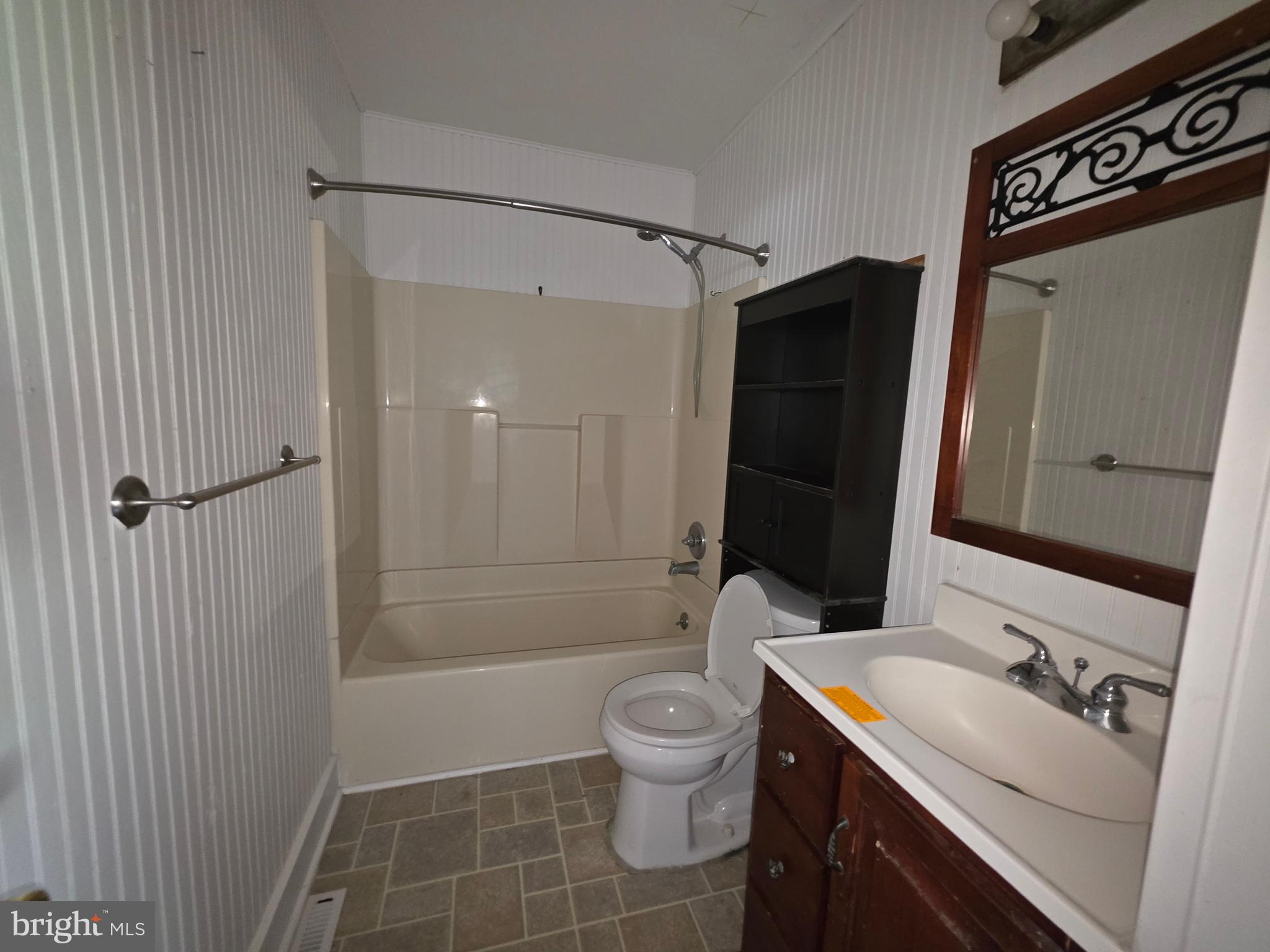 2590 Hallowing Point Road Prince Frederick, MD 20678 - Photo 7 of 10 a bathroom with a sink a toilet and shower