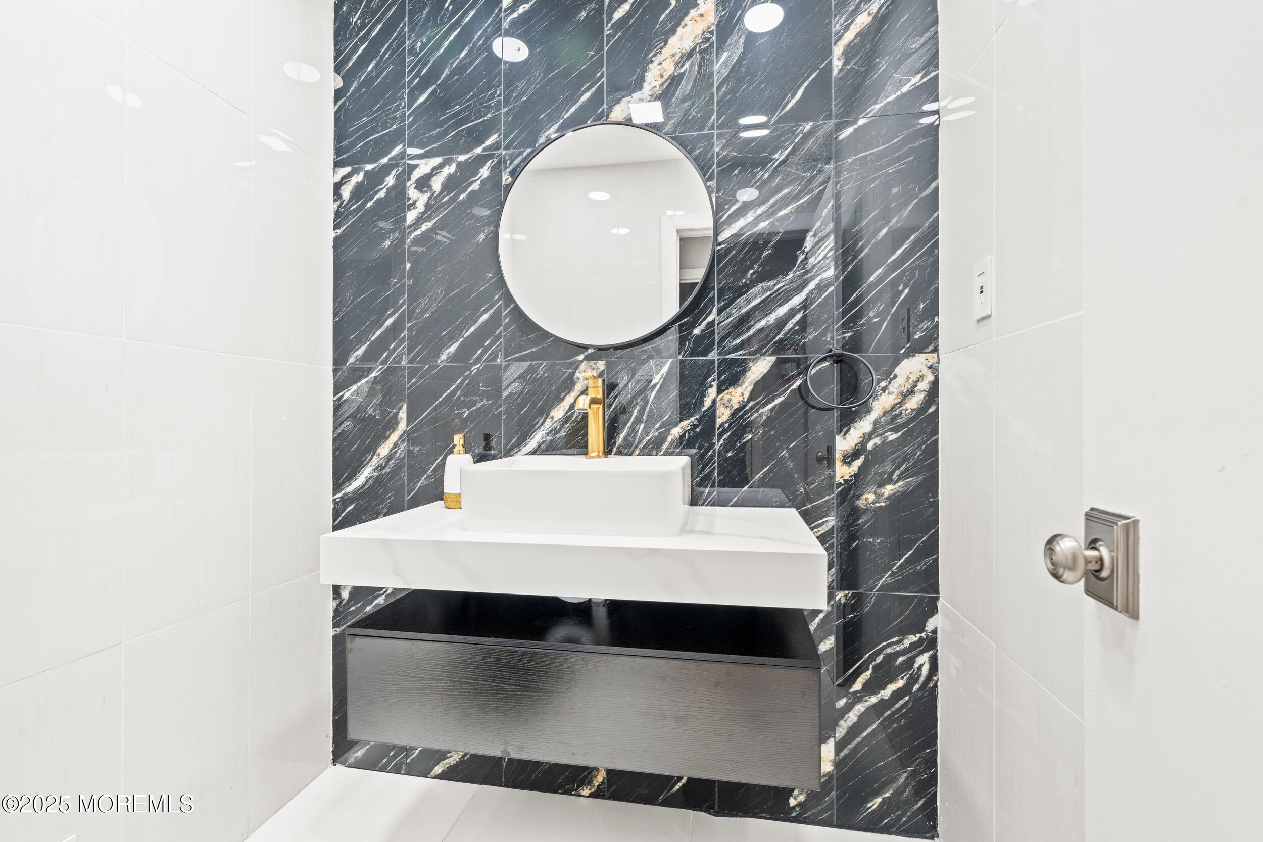 24 Valley Forge Road Eatontown, NJ 07724 - Photo 11 of 23 a bathroom with a sink and a mirror