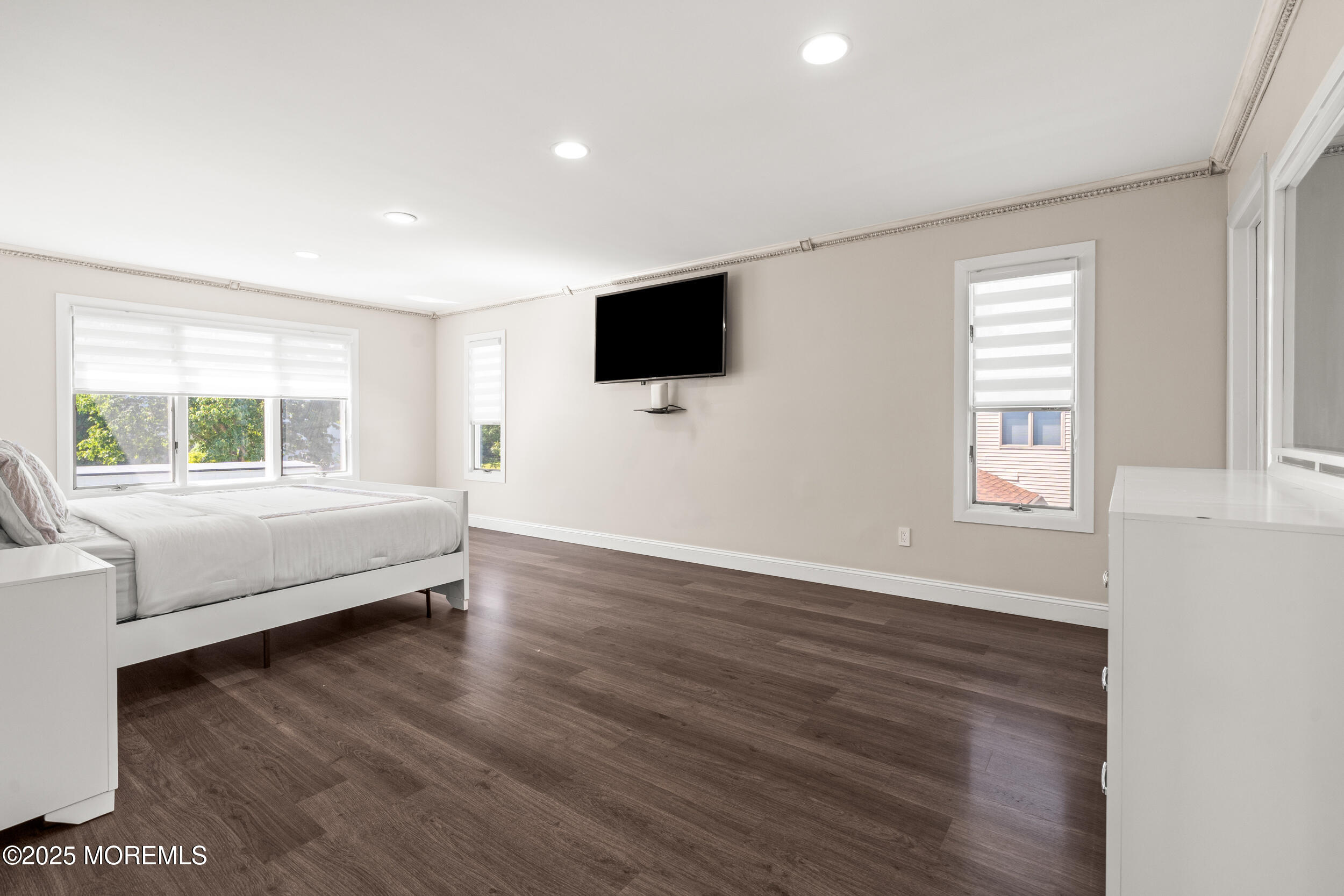 24 Valley Forge Road Eatontown, NJ 07724 - Photo 12 of 23 a living room with couch wooden floor and a flat screen tv