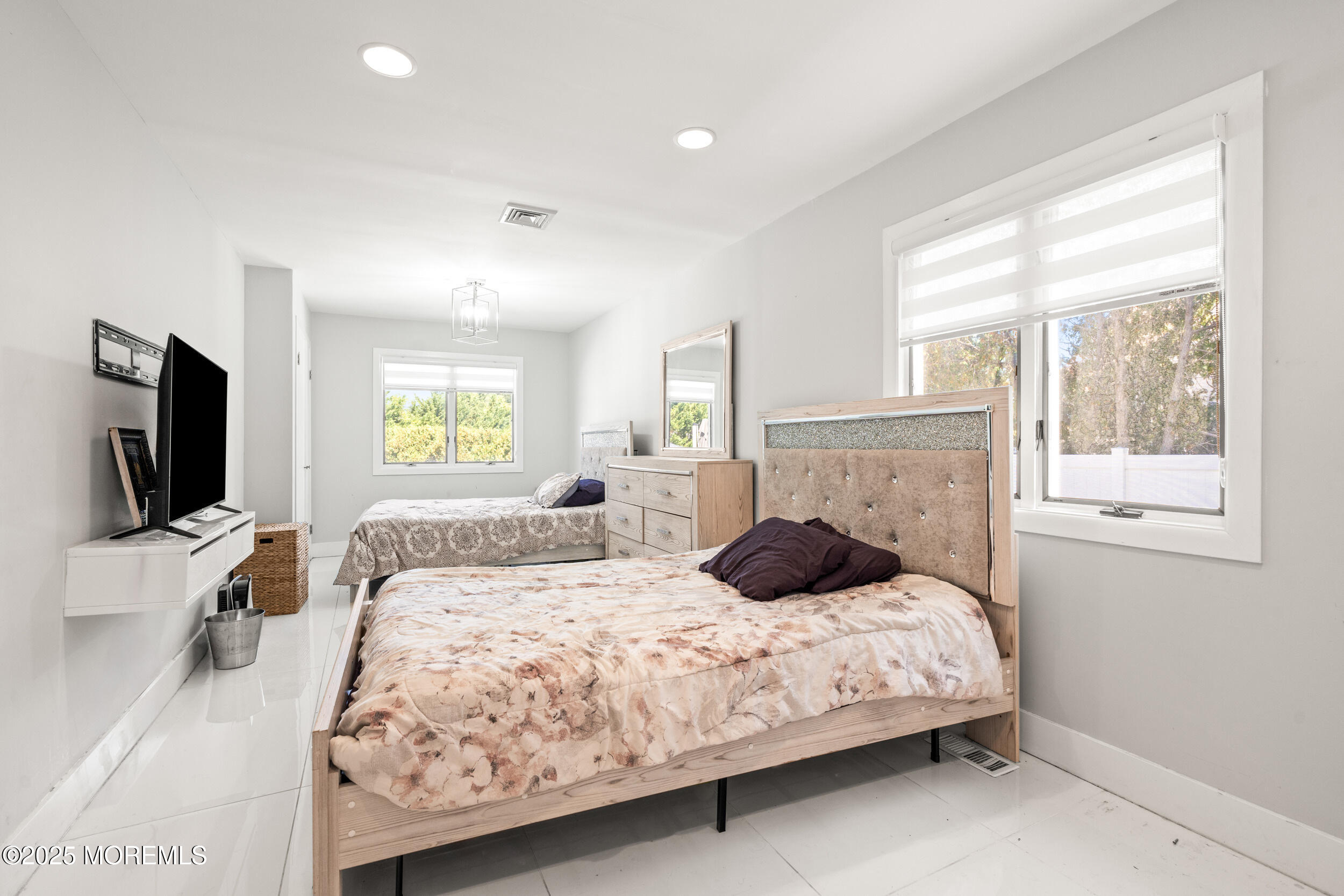 24 Valley Forge Road Eatontown, NJ 07724 - Photo 13 of 23 a bedroom with a bed and a flat screen tv