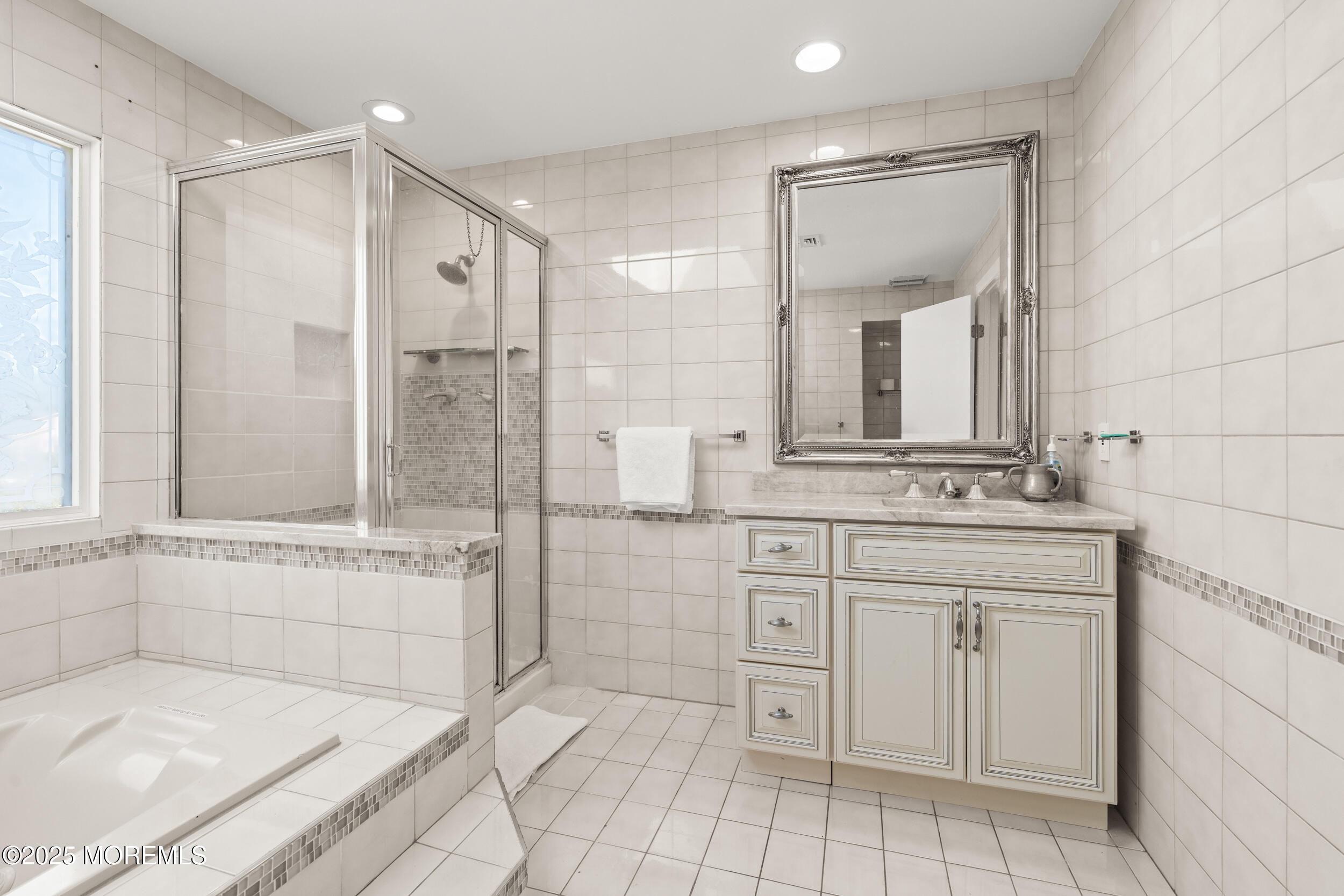 24 Valley Forge Road Eatontown, NJ 07724 - Photo 16 of 23 a bathroom with a tub sink and mirror