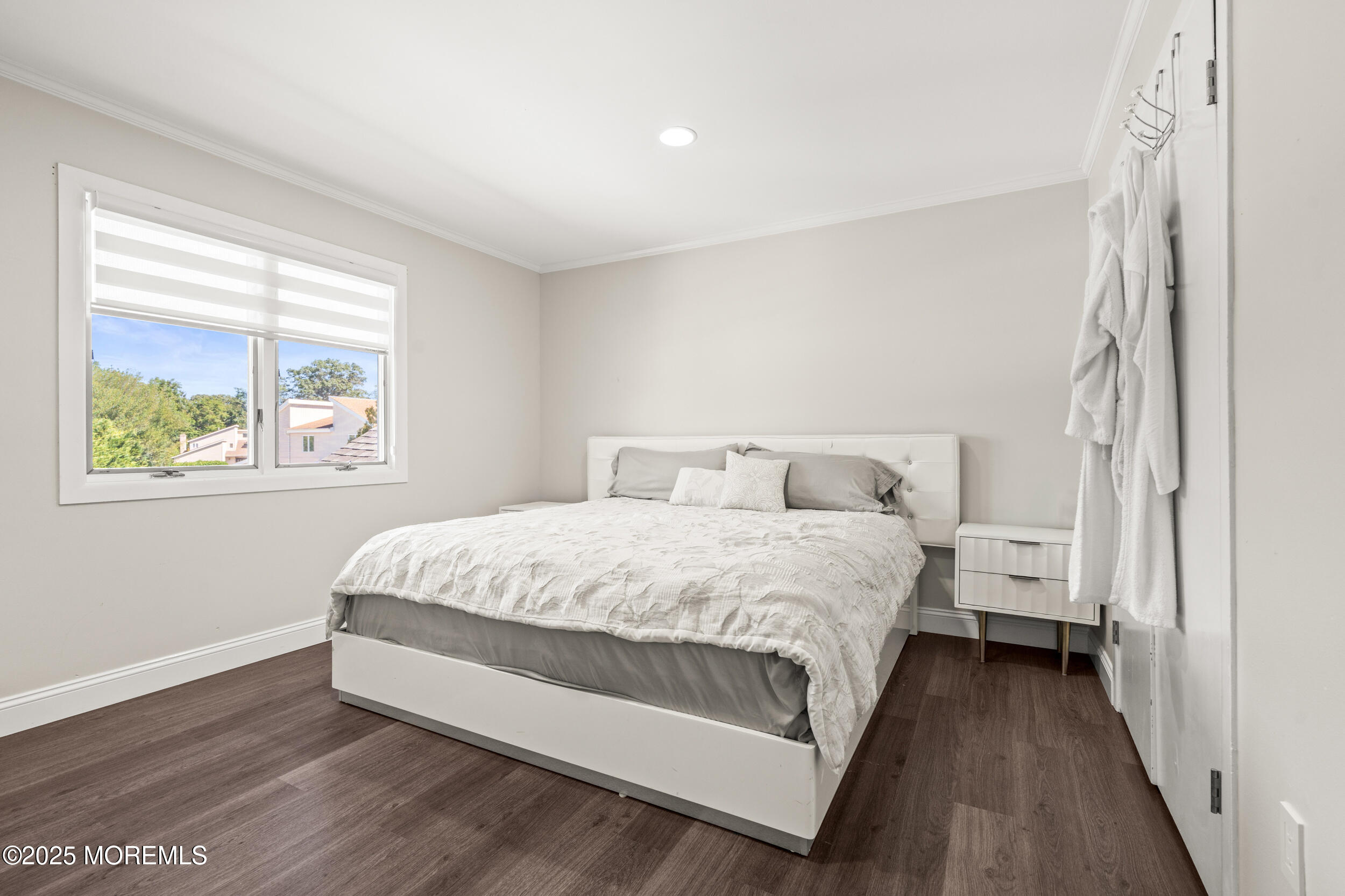 24 Valley Forge Road Eatontown, NJ 07724 - Photo 19 of 23 a large bed sitting in a bedroom next to a window