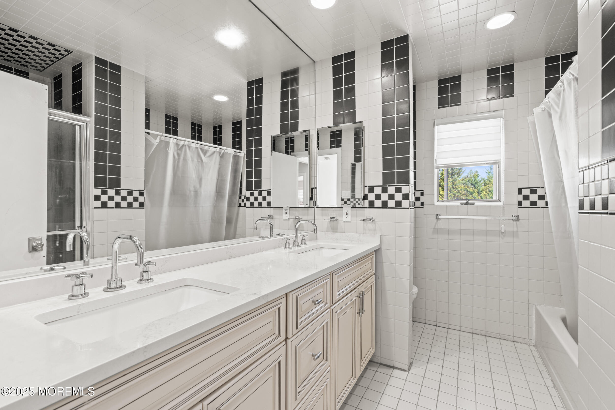 24 Valley Forge Road Eatontown, NJ 07724 - Photo 20 of 23 a bathroom with double vanity sinks a mirror and a shower