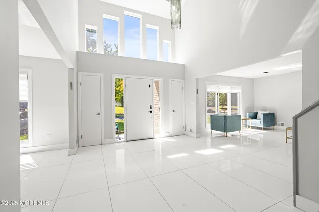 a view of a big room with closet and windows