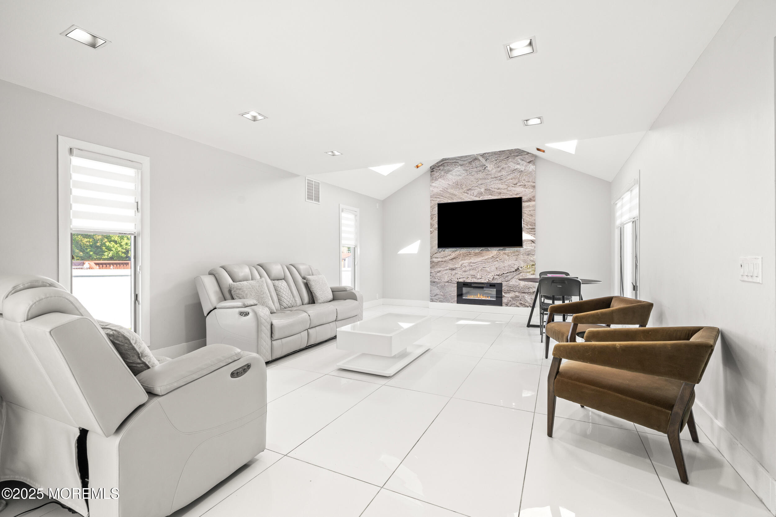 24 Valley Forge Road Eatontown, NJ 07724 - Photo 4 of 23 a living room with furniture and a flat screen tv