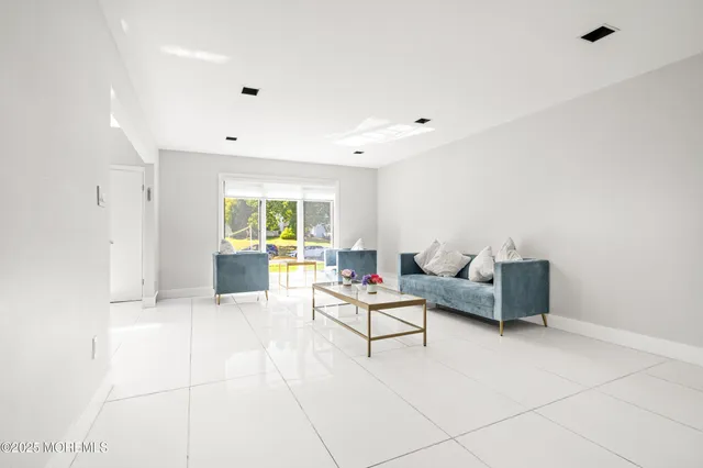 a living room with furniture and a table