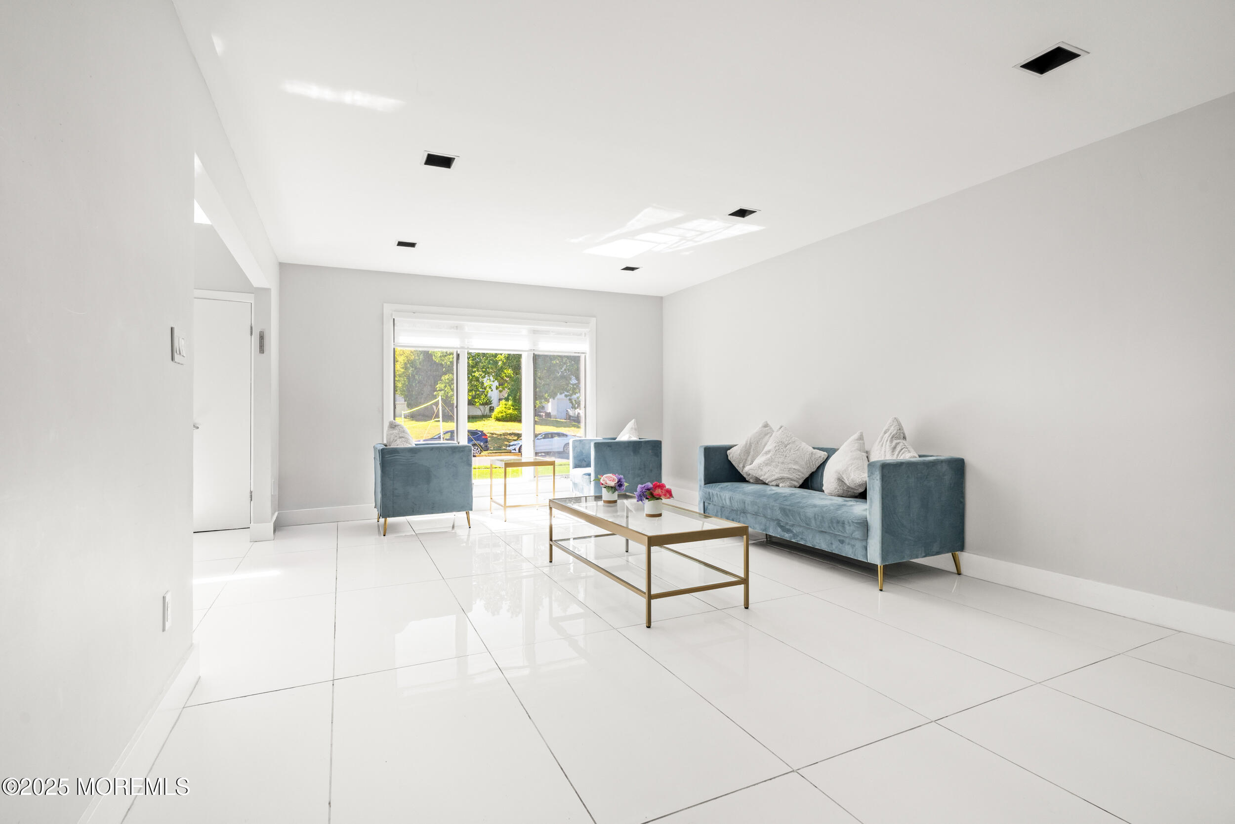 24 Valley Forge Road Eatontown, NJ 07724 - Photo 7 of 23 a living room with furniture and a table