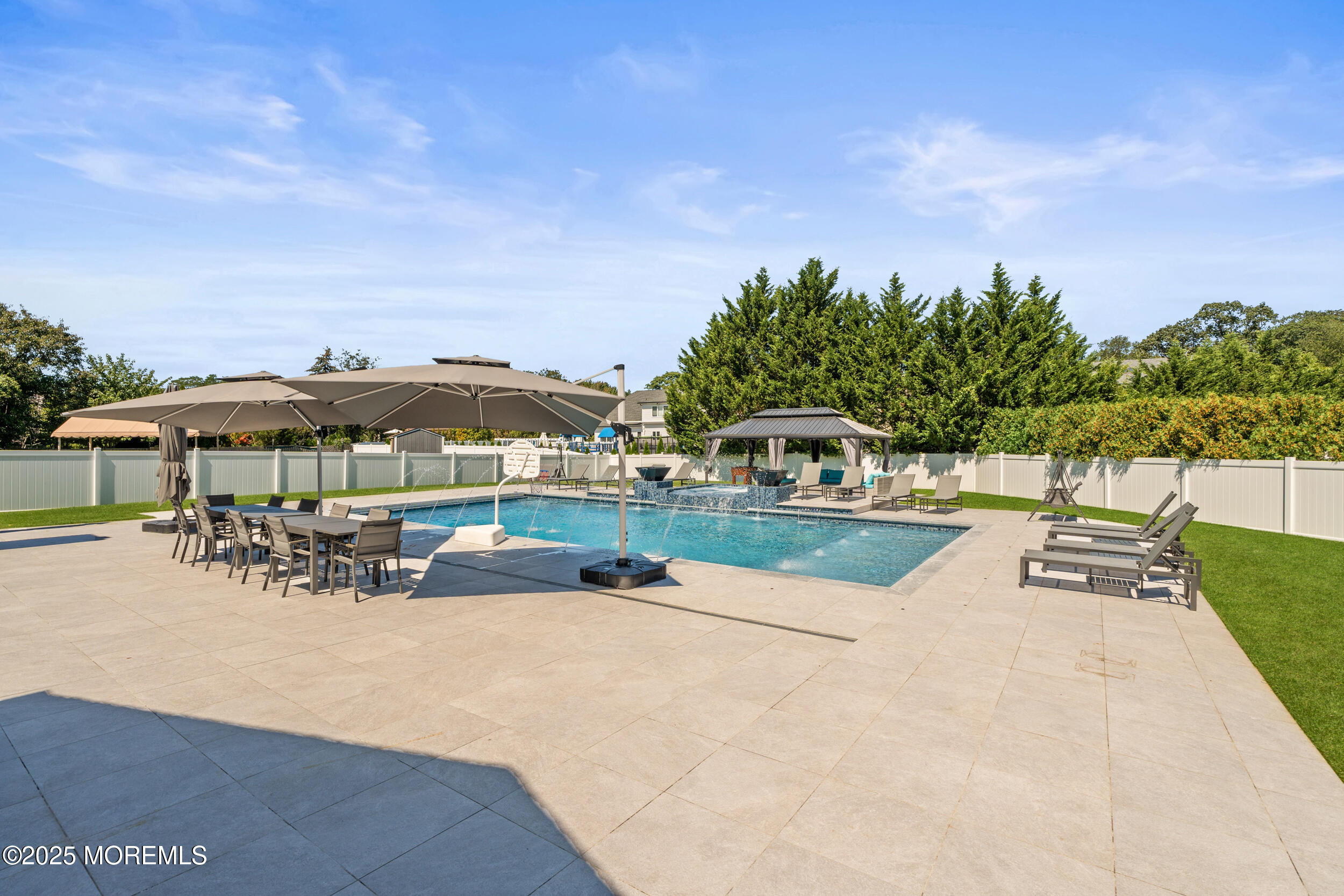 24 Valley Forge Road Eatontown, NJ 07724 - Photo 9 of 23 an outdoor space with patio and white umbrellas