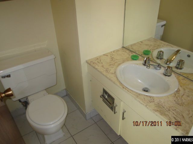 100 North Arlington Avenue, Unit 19H Reno, NV 89501 - Photo 4 of 11 a bathroom with a sink and a toilet