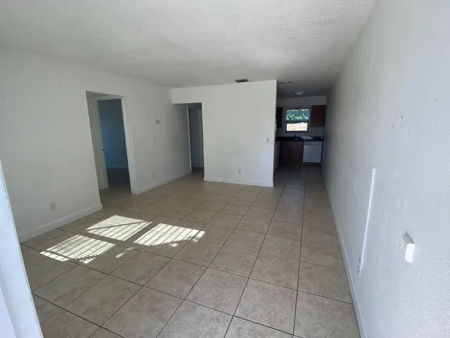 a view of an empty room with a bathroom