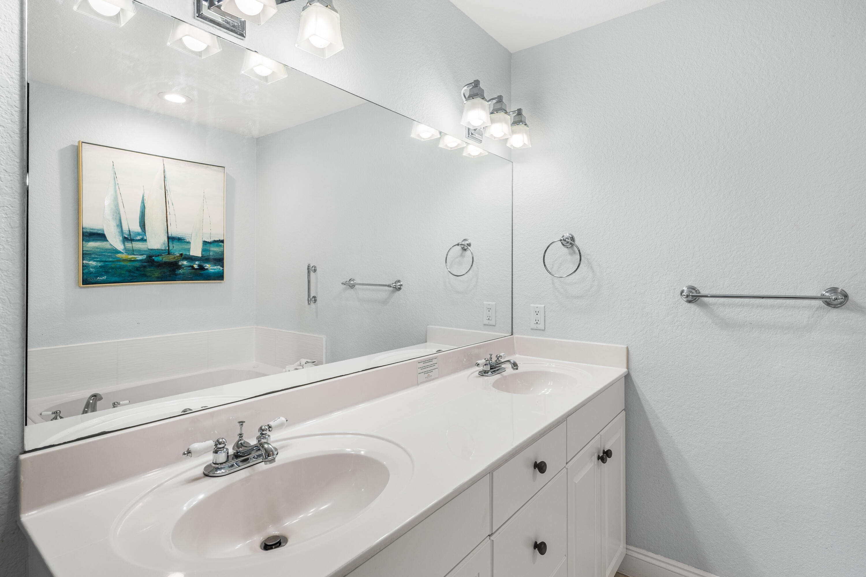 33 Dune Breeze Lane, Unit H2 Santa Rosa Beach, FL 32459 - Photo 21 of 54 a bathroom with a sink a large mirror and vanity