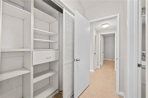 a view of a hallway with closet