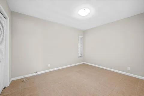 an empty room with a empty space and window