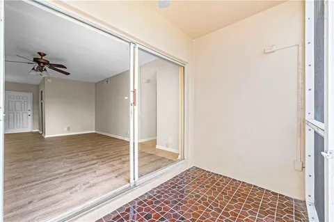a view of a hallway with a chandelier