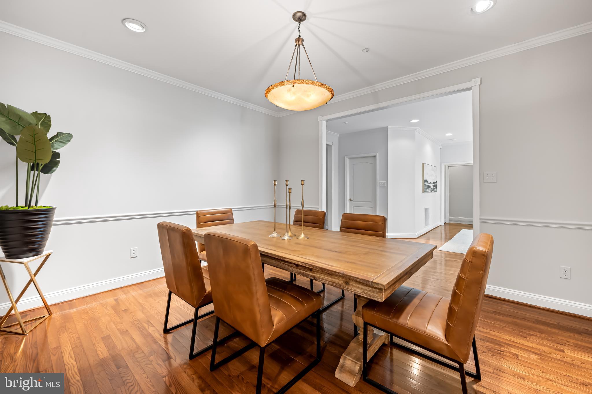24 Roland Green, Unit 12 Baltimore, MD 21210 - Photo 10 of 53 a view of a dining room with furniture and wooden floor