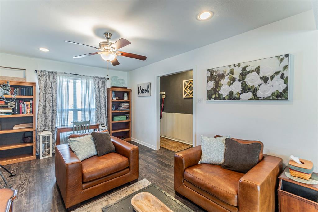 708 North Stewart Street Azle, TX 76020 - Photo 5 of 25 a living room with furniture and wooden floor
