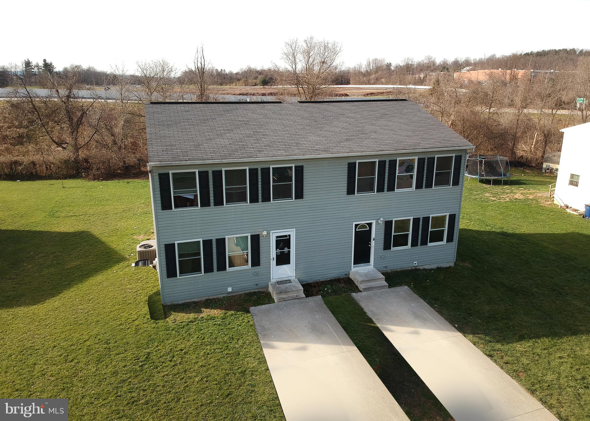 a house view with a garden space