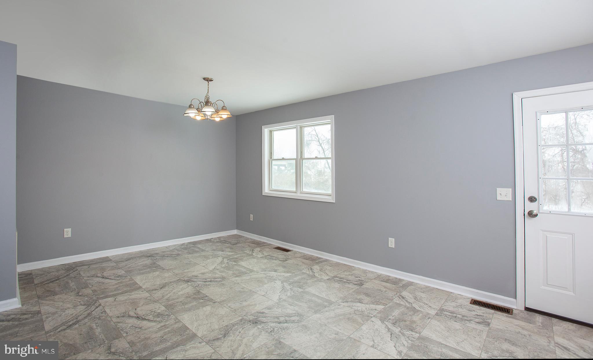 1031 Oberlin Road Middletown, PA 17057 - Photo 15 of 39 wooden floor in an empty room with a window