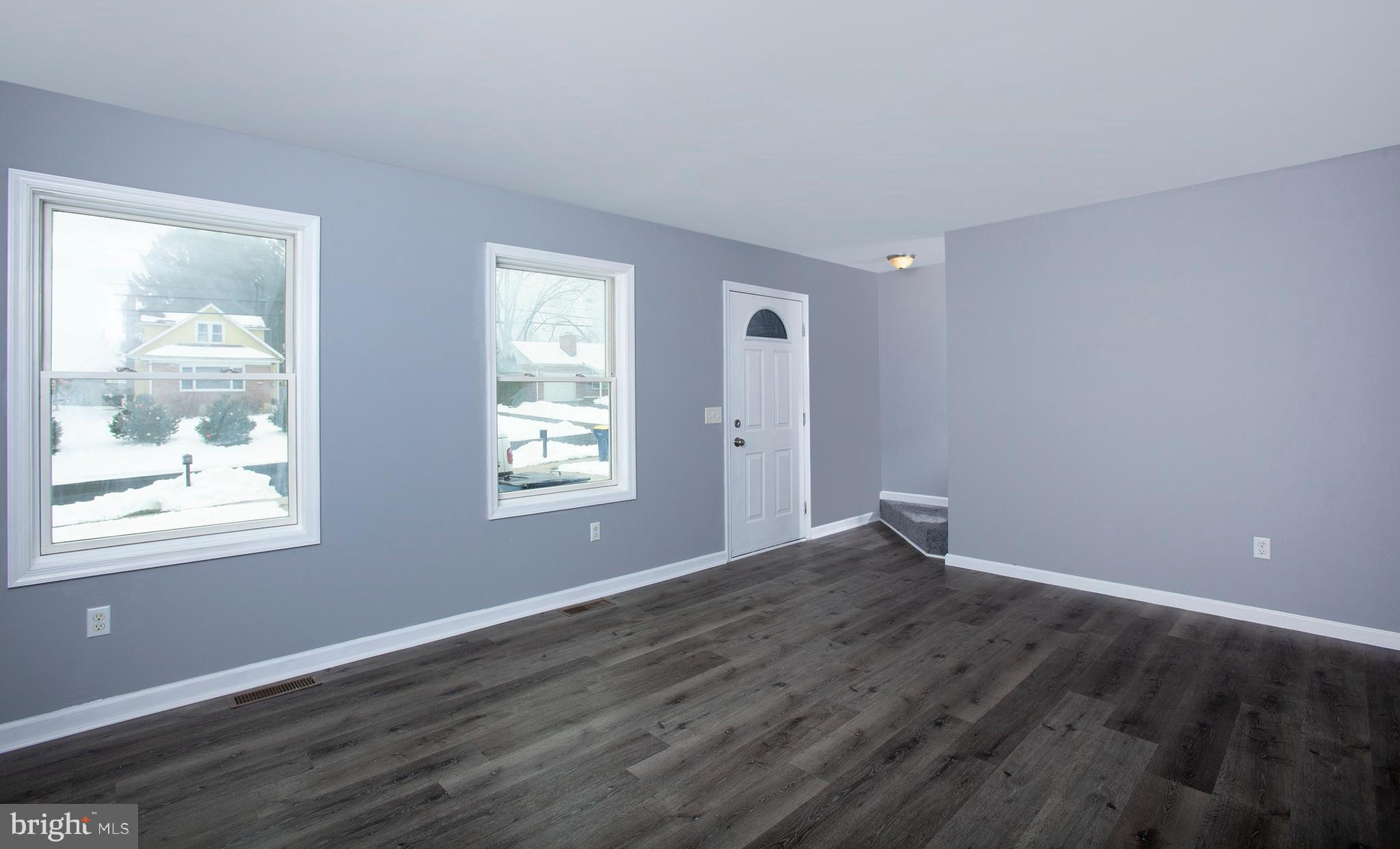 1031 Oberlin Road Middletown, PA 17057 - Photo 19 of 39 a view of an empty room with wooden floor and a window