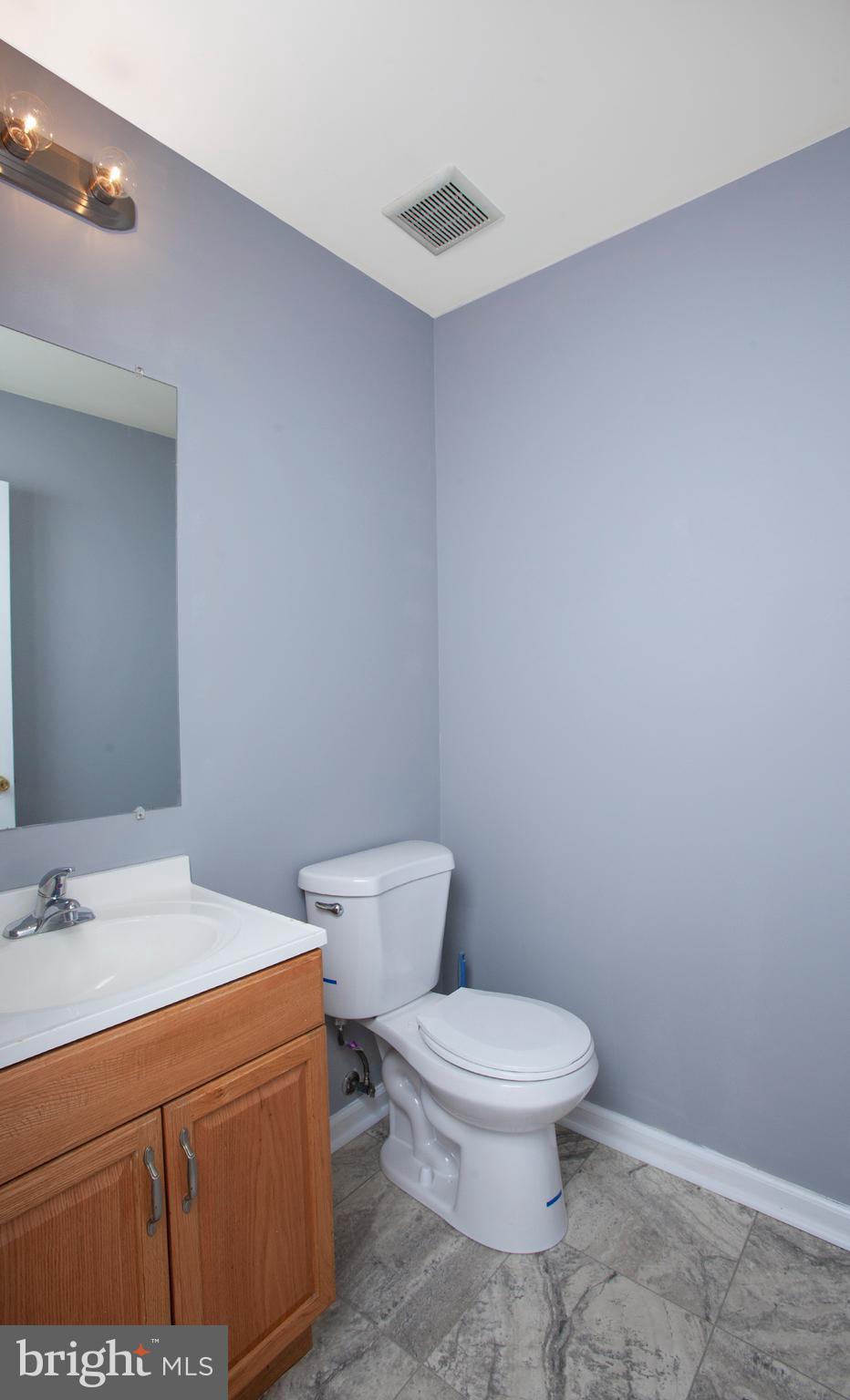1031 Oberlin Road Middletown, PA 17057 - Photo 20 of 39 a white toilet sitting next to a bathroom sink