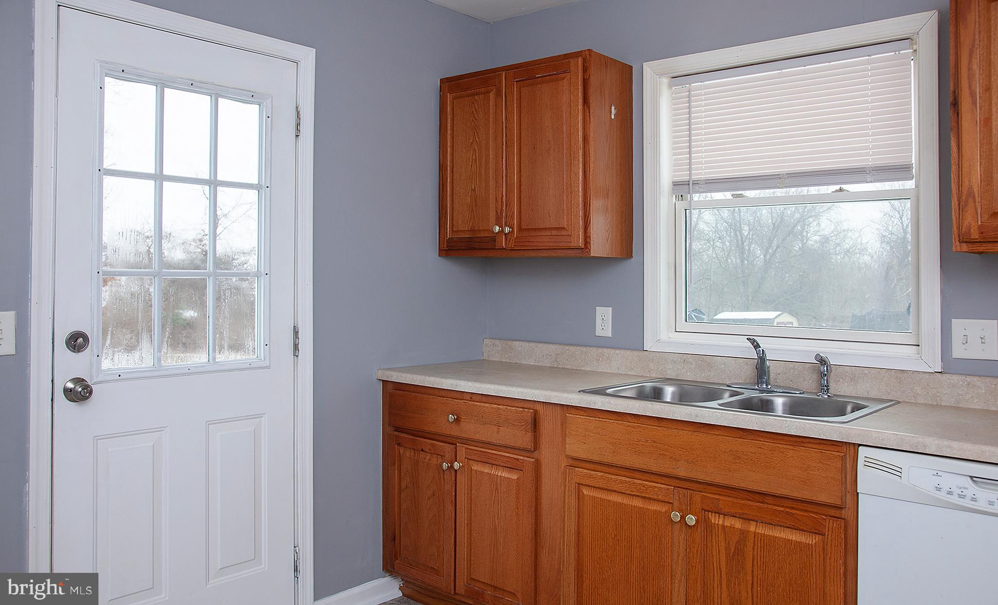 1031 Oberlin Road Middletown, PA 17057 - Photo 10 of 39 a kitchen with stainless steel appliances granite countertop a sink and a window