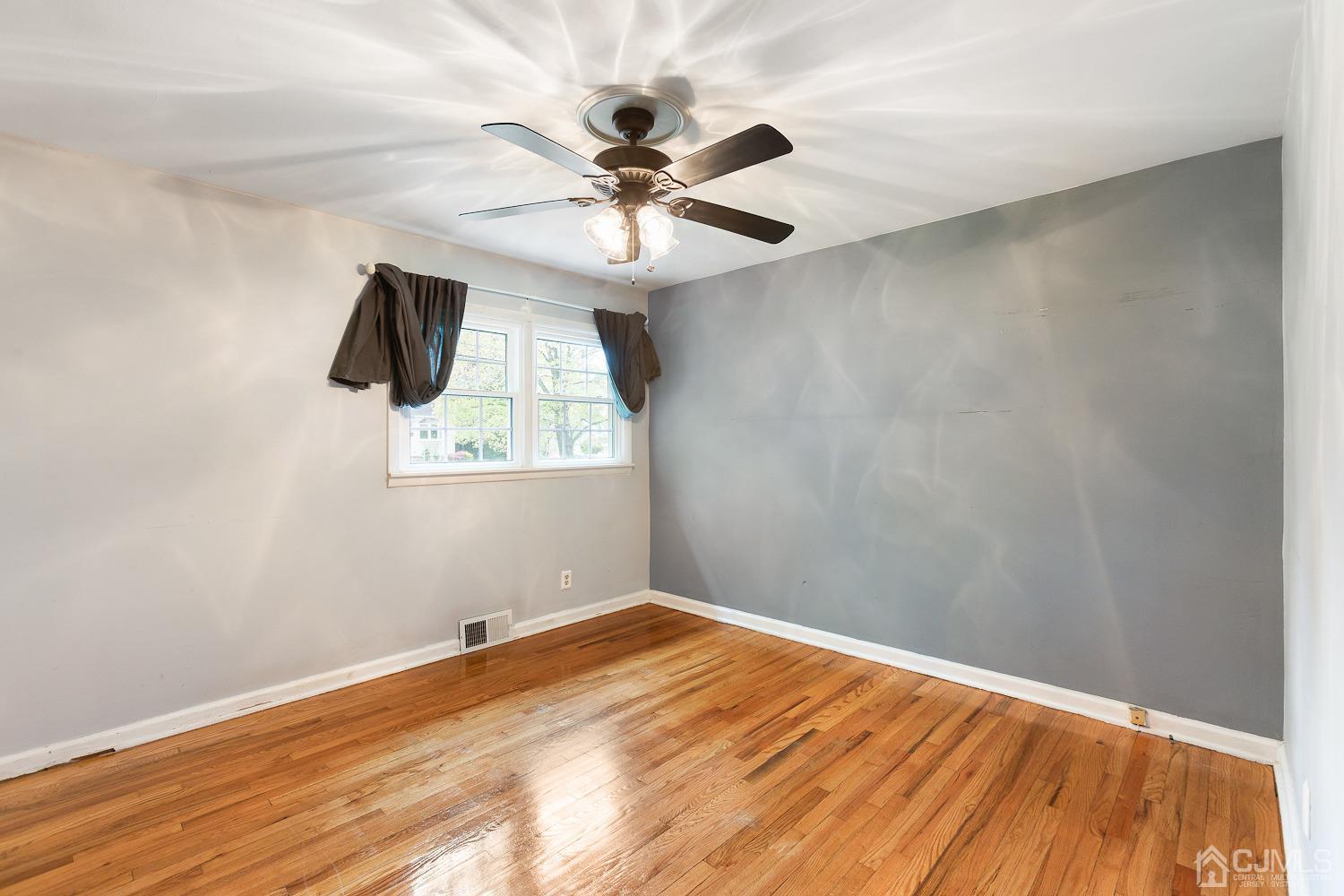 60 Wilcox Road New Brunswick, NJ 08901 - Photo 12 of 25 a view of a big room with wooden floor and windows