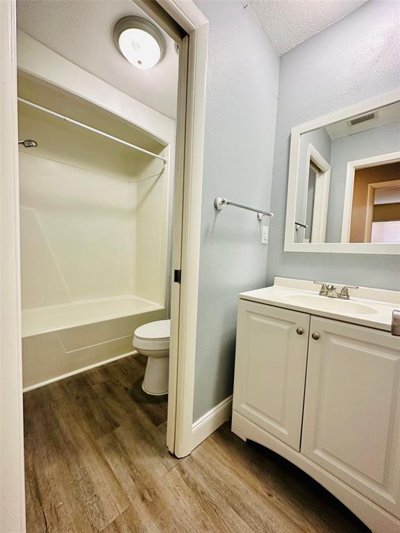 8002 Hibiscus Drive, Unit 8002 Temple Terrace, FL 33637 - Photo 11 of 16 a bathroom with a sink a toilet and a shower