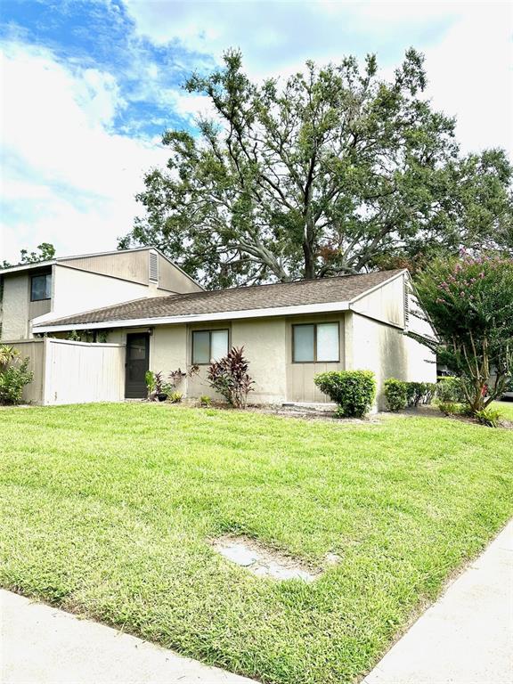 8002 Hibiscus Drive, Unit 8002 Temple Terrace, FL 33637 - Photo 3 of 16 a view of a yard in front of house