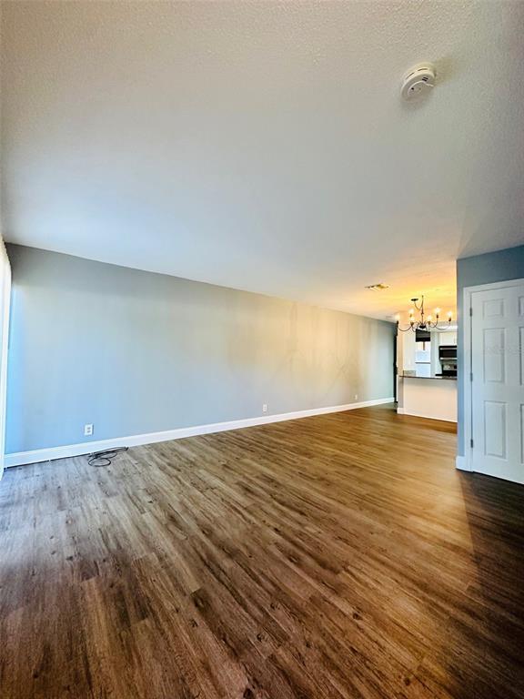 8002 Hibiscus Drive, Unit 8002 Temple Terrace, FL 33637 - Photo 6 of 16 a view of empty room with wooden floor