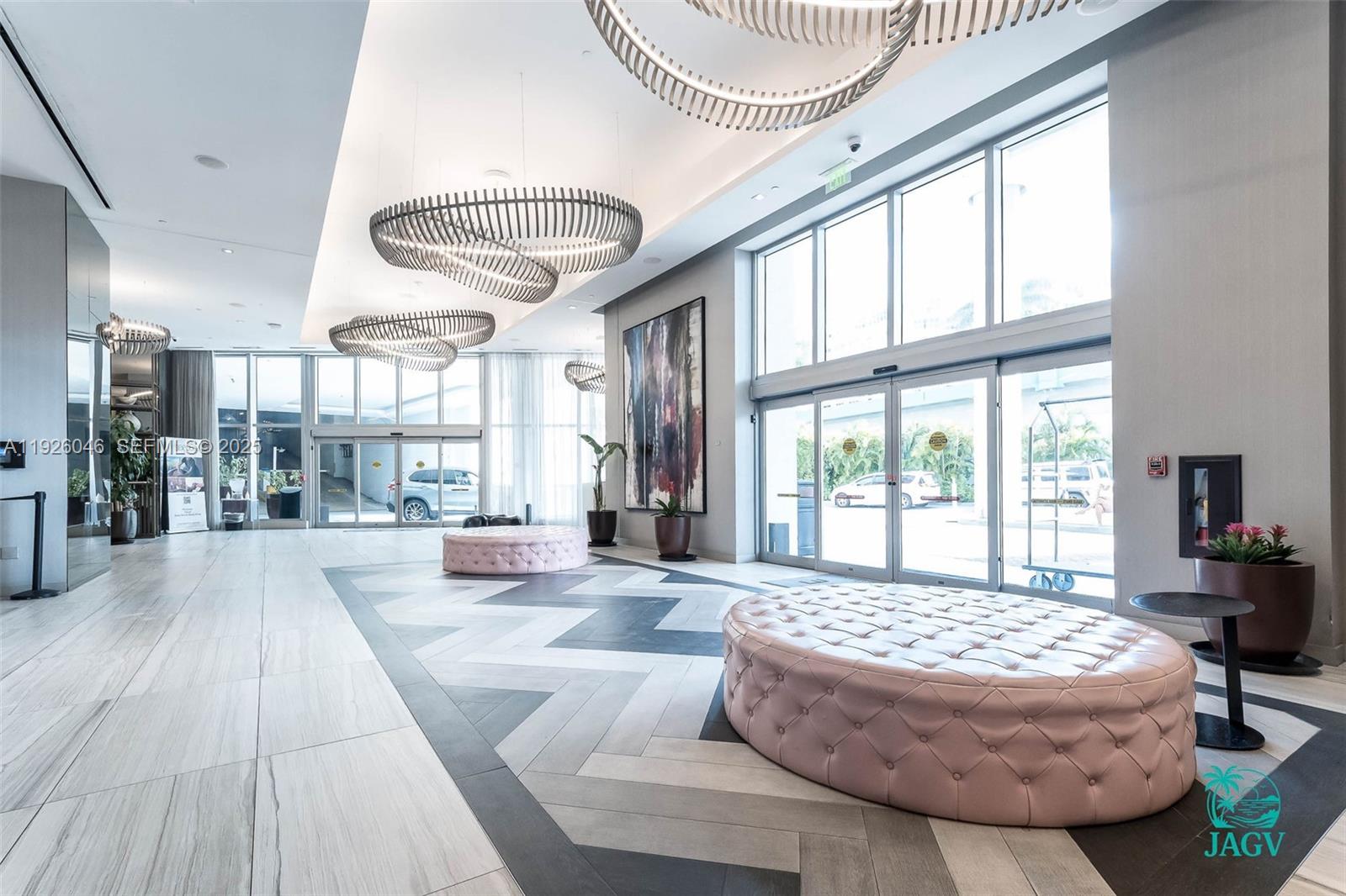 4010 South Ocean Drive, Unit R3005 Hollywood, FL 33019 - Photo 11 of 57 a living room with a large bed and a large window